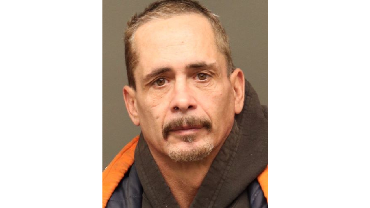 Daniel-Patterson.png in a hooded jacket with a neutral expression